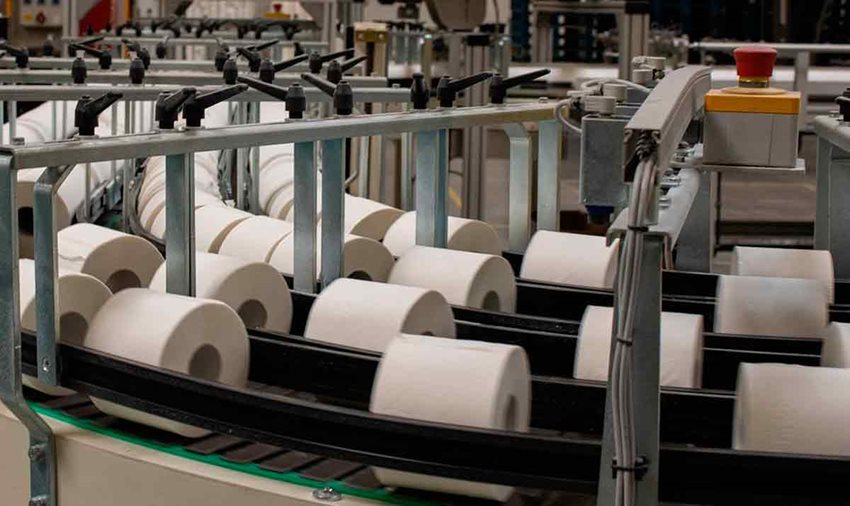 Máquina organizadora de papel higiénico, con muchos rollos dentro.