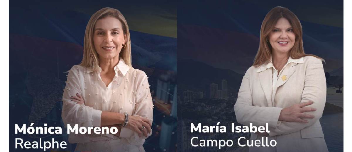 Descripción imagen: Dos mujeres posando para la foto, con los brazos cruzados y sonriendo.